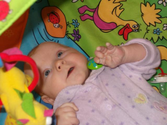 Fascinated by her play mat